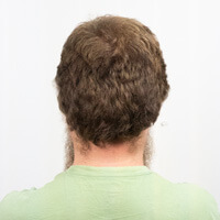 Photo of Chris Joel, facing away from the camera